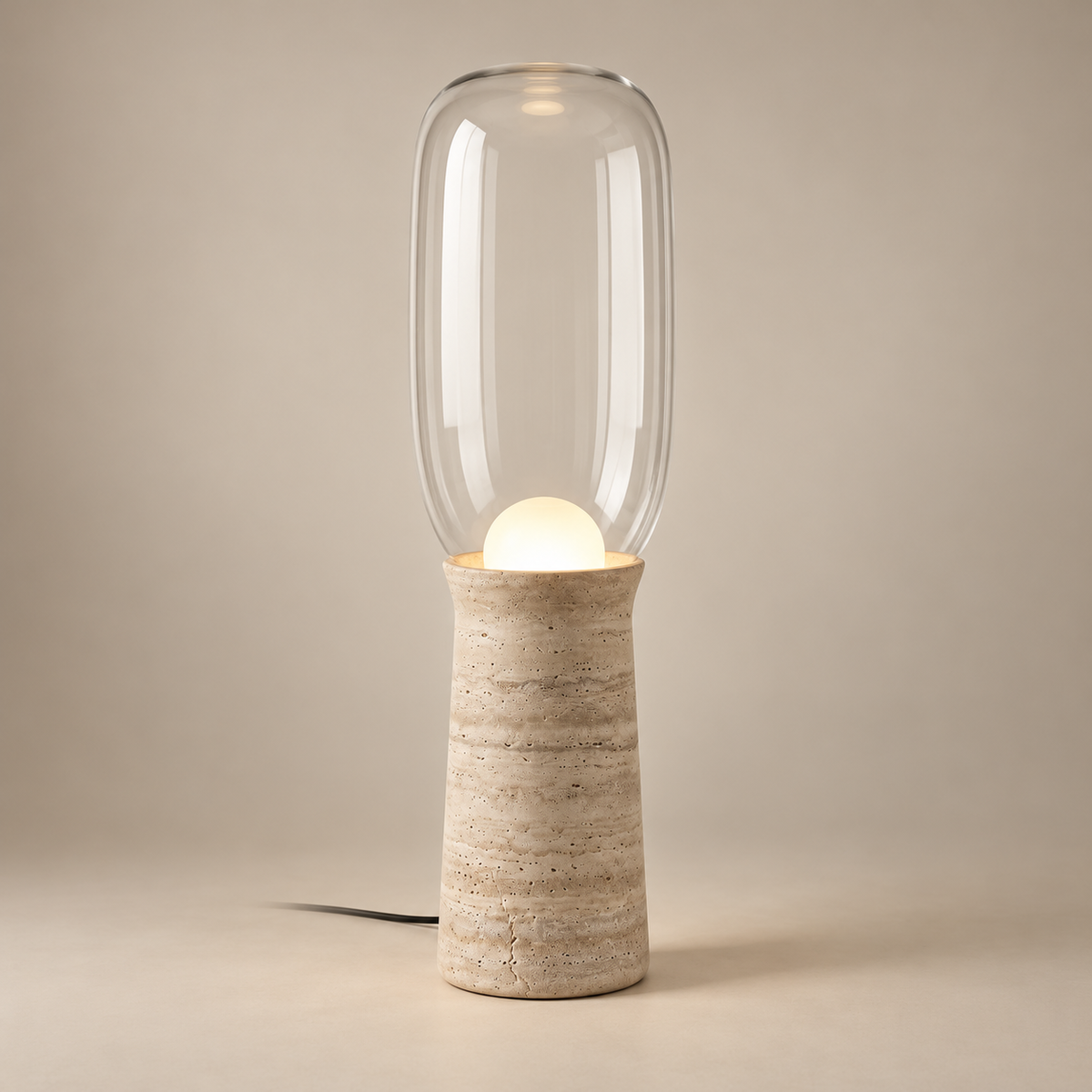 Torch Marble LED Floor Lamp on a warm greige background; Beige travertine clear capsule floor lamp