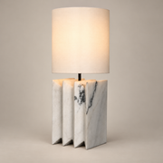 Jman Minimalist Marble Table Lamp on a warm greige background; White marble accordion base fabric shade