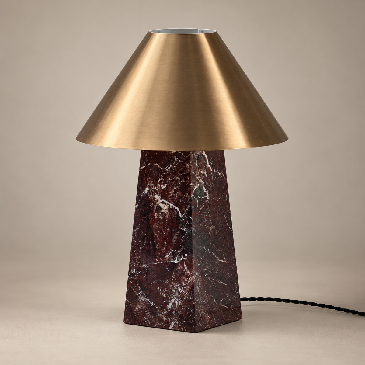 Derin Mushroom Marble Table Lamp on a warm greige background; Deep burgundy marble brass cone table lamp