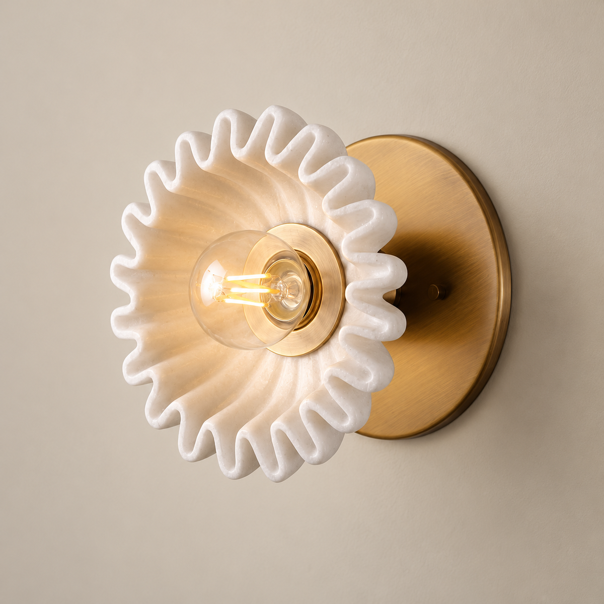 Lola Surface Marble Wall Sconce on a warm greige background; White ruffled marble surface wall sconce