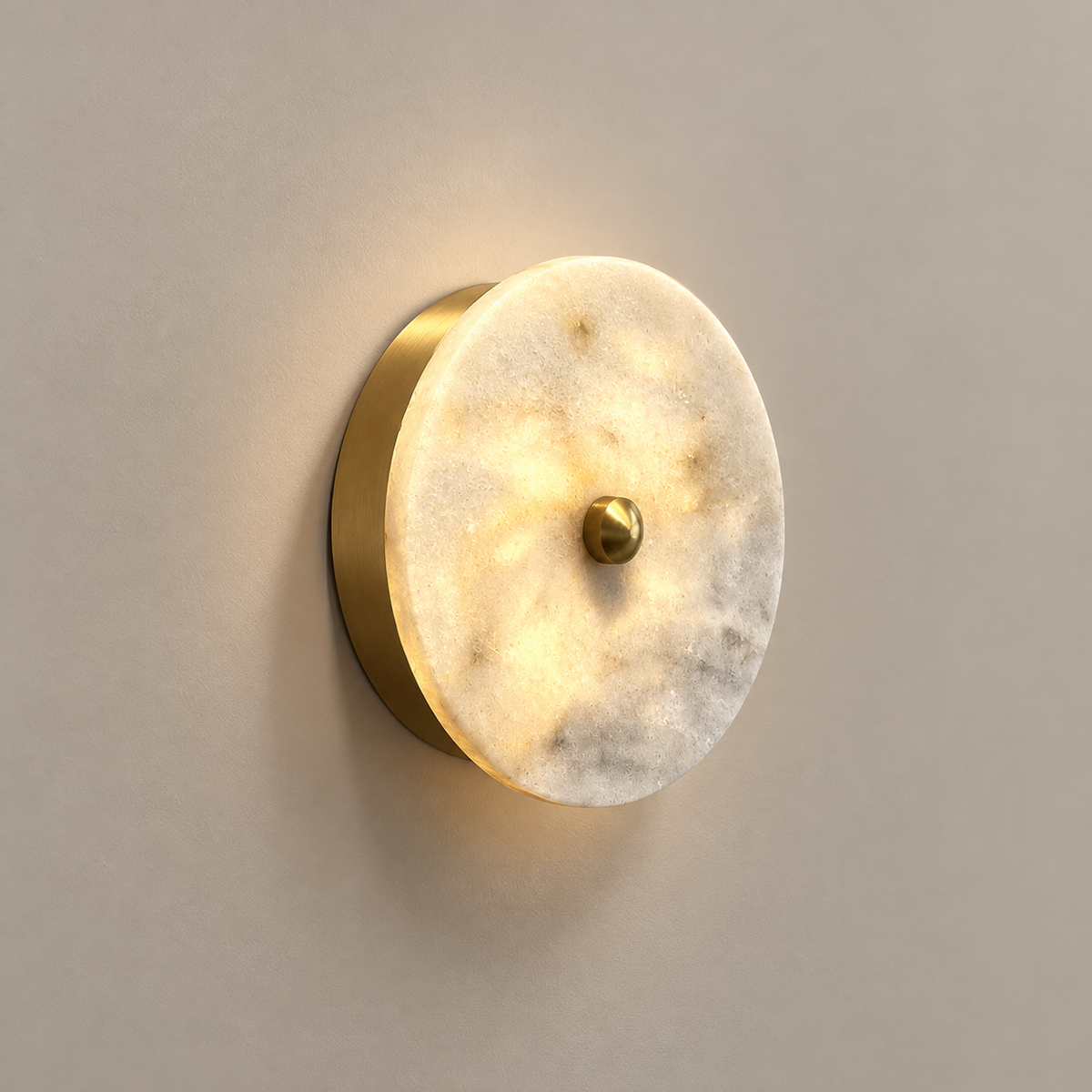 Beran Marble LED Wall Sconce on a warm greige background; White natural stone disk small brass cap
