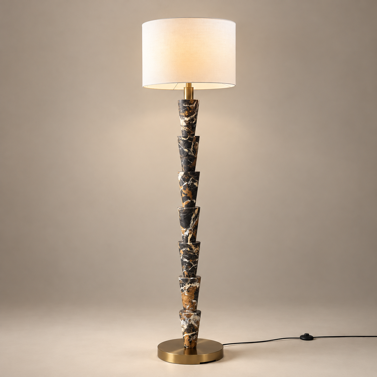 Nizwa Traditional Marble Floor Lamp on a warm greige background; Seven stacked marble cones white drum floor lamp