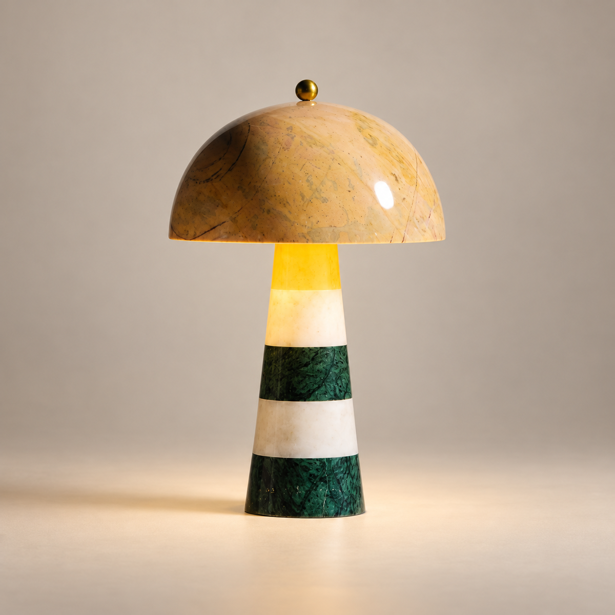 Hed Art Deco Marble Table Lamp on a warm greige background; Yellow dome / green-white striped marble stem