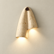 Pearlmont Japandi Travertine Wall Sconce on a warm greige background; Beige / left longer downward orientation