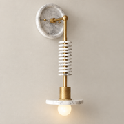 Asteria Art Deco Marble Wall Sconce on a warm greige background; Natural Brass & White