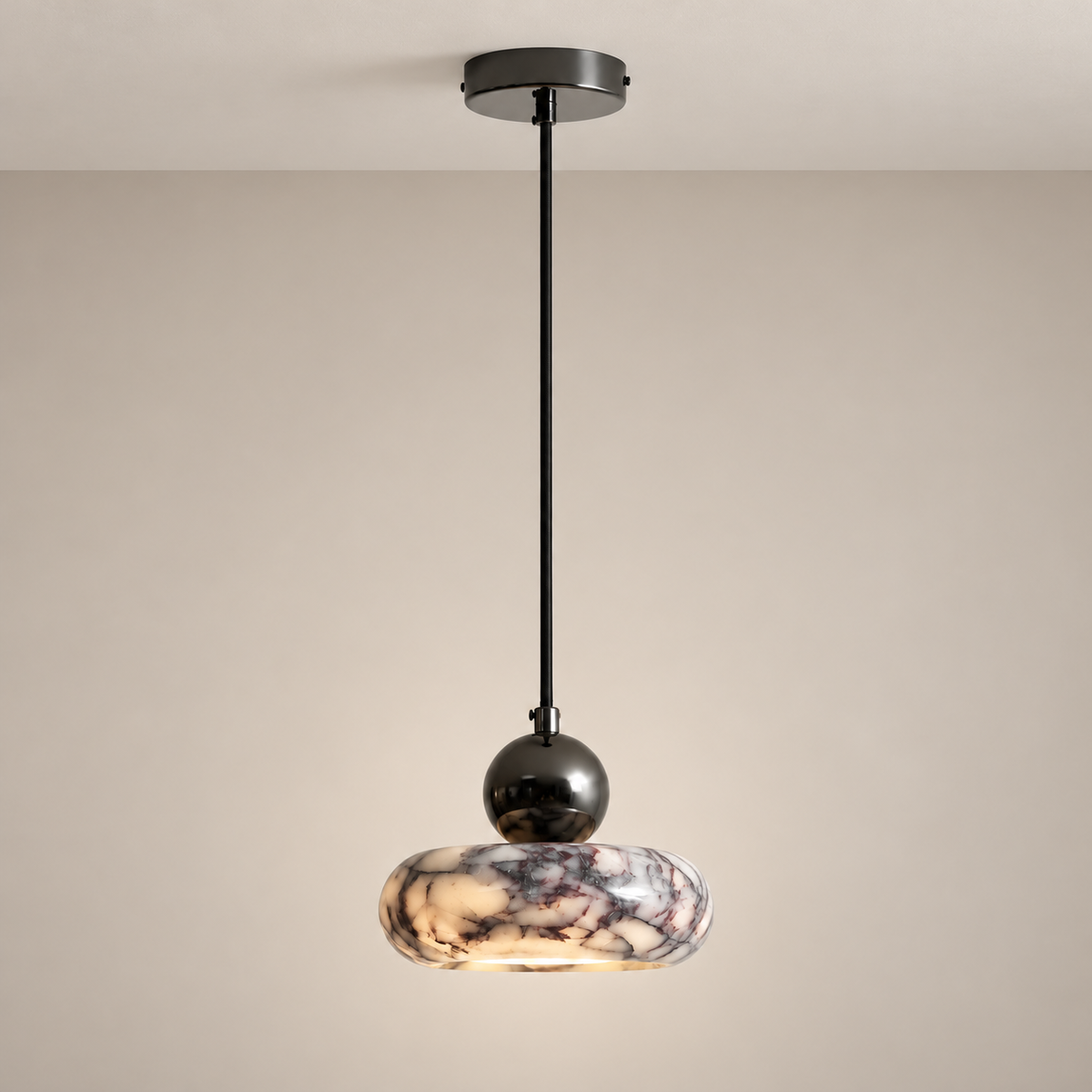 Purple-veined marble ring pendant with a dark metal sphere and long cord mounted to a ceiling