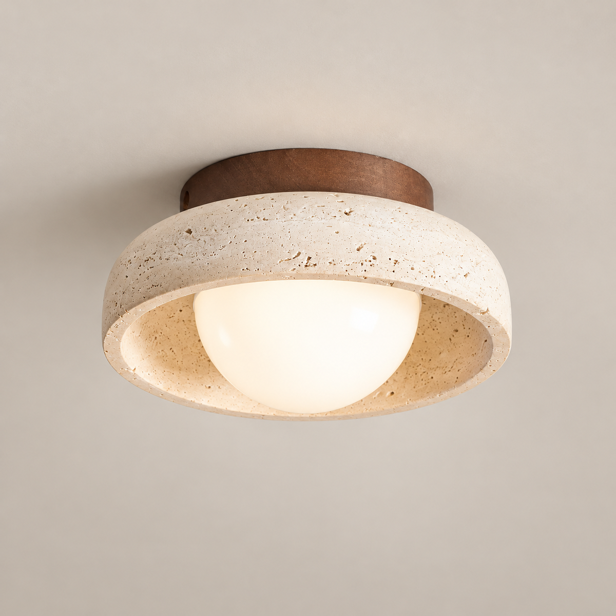 Piedra Travertine LED Ceiling Light on a warm greige background; Travertine and walnut