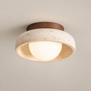 Piedra Travertine LED Ceiling Light on a warm greige background; Travertine and walnut