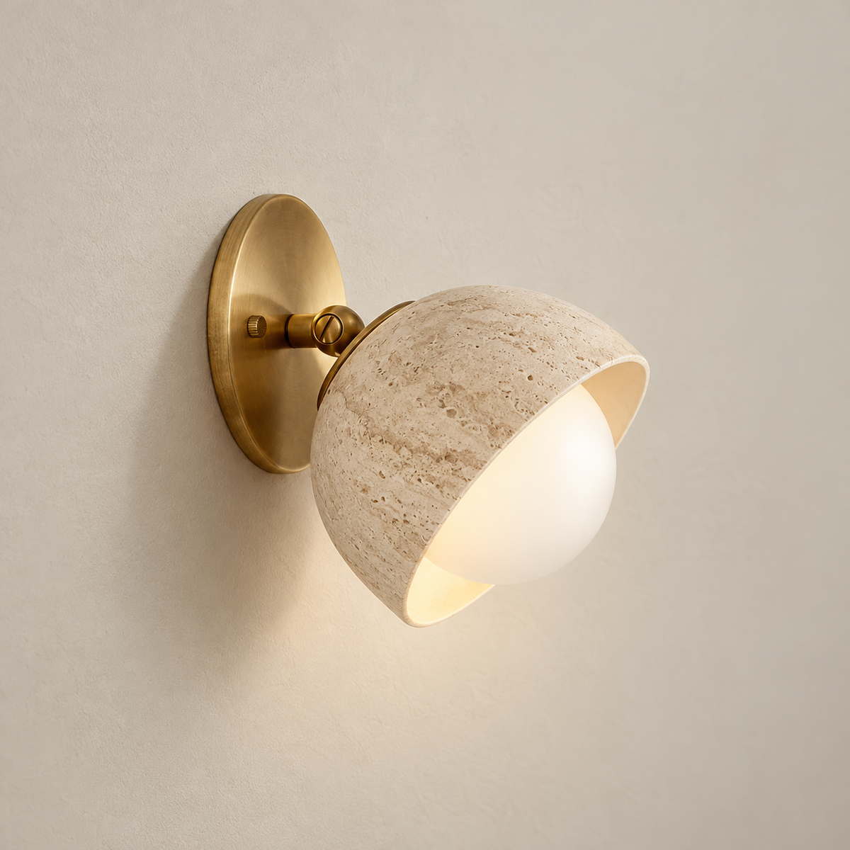 Terra Surface Travertine Wall Sconce on a warm greige background; Gold & Beige