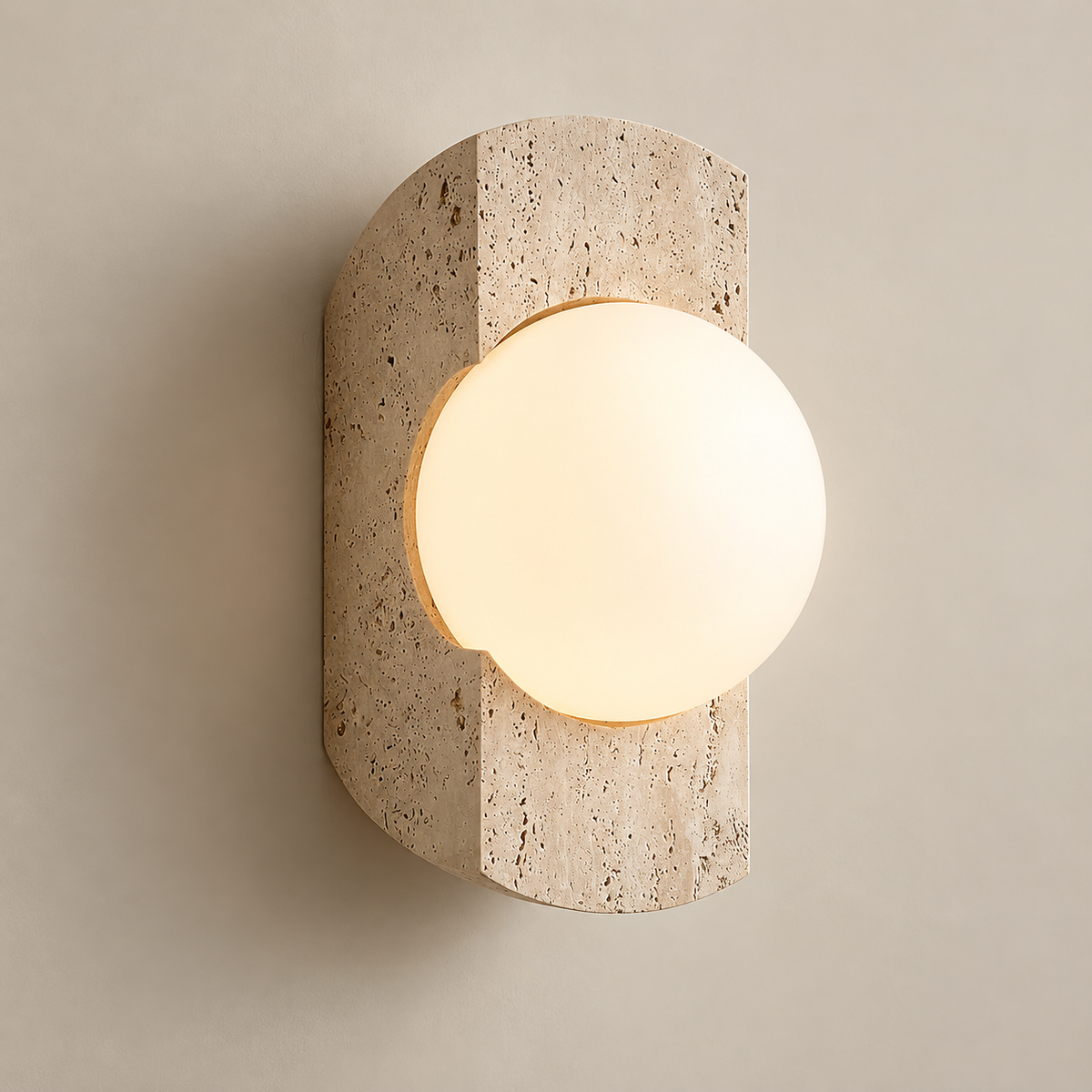 Neptune Travertine Globe Wall Sconce on a warm greige background; Beige