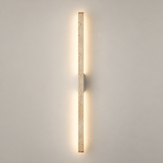 Prometheus Travertine LED Wall Sconce on a warm greige background; Beige