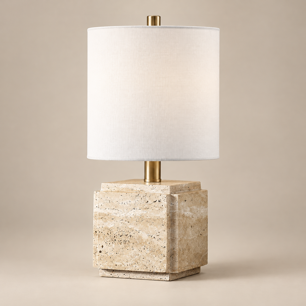 Kovac Travertine Table Lamp on a warm greige background; Beige & White