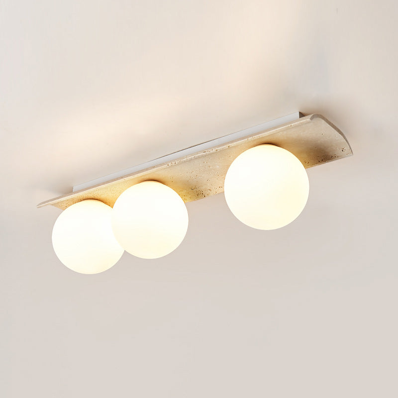 Bianca Globe Travertine Ceiling Light — 3 heads L 65cm x W 16cm x H 20cm / L 25.6″ x W 6.3″ x H 7.9″; Beige & White glass