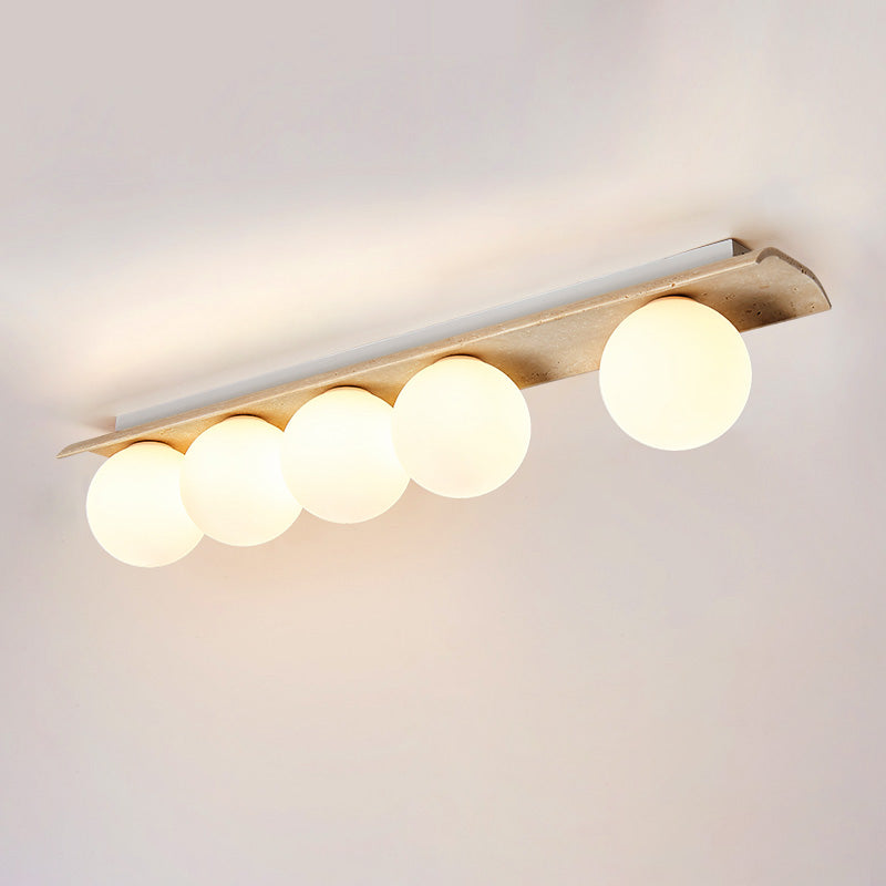Bianca Globe Travertine Ceiling Light — 5 heads L 97cm x W 16cm x H 20cm / L 38.2″ x W 6.3″ x H 7.9″; Beige & White glass