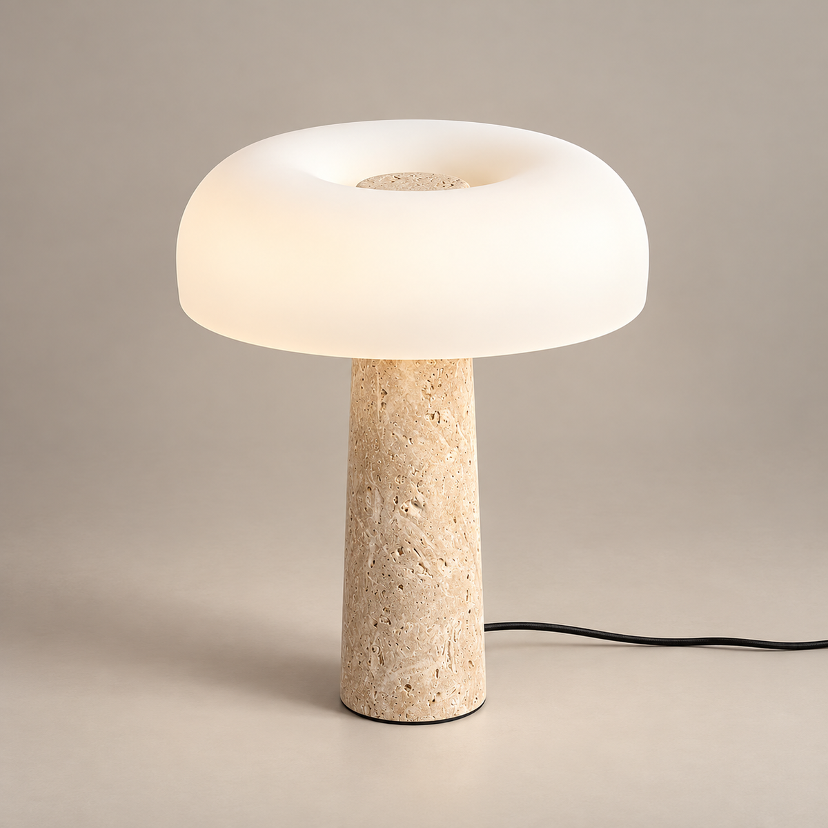 Carla Travertine Table Lamp on a warm greige background; Beige & White