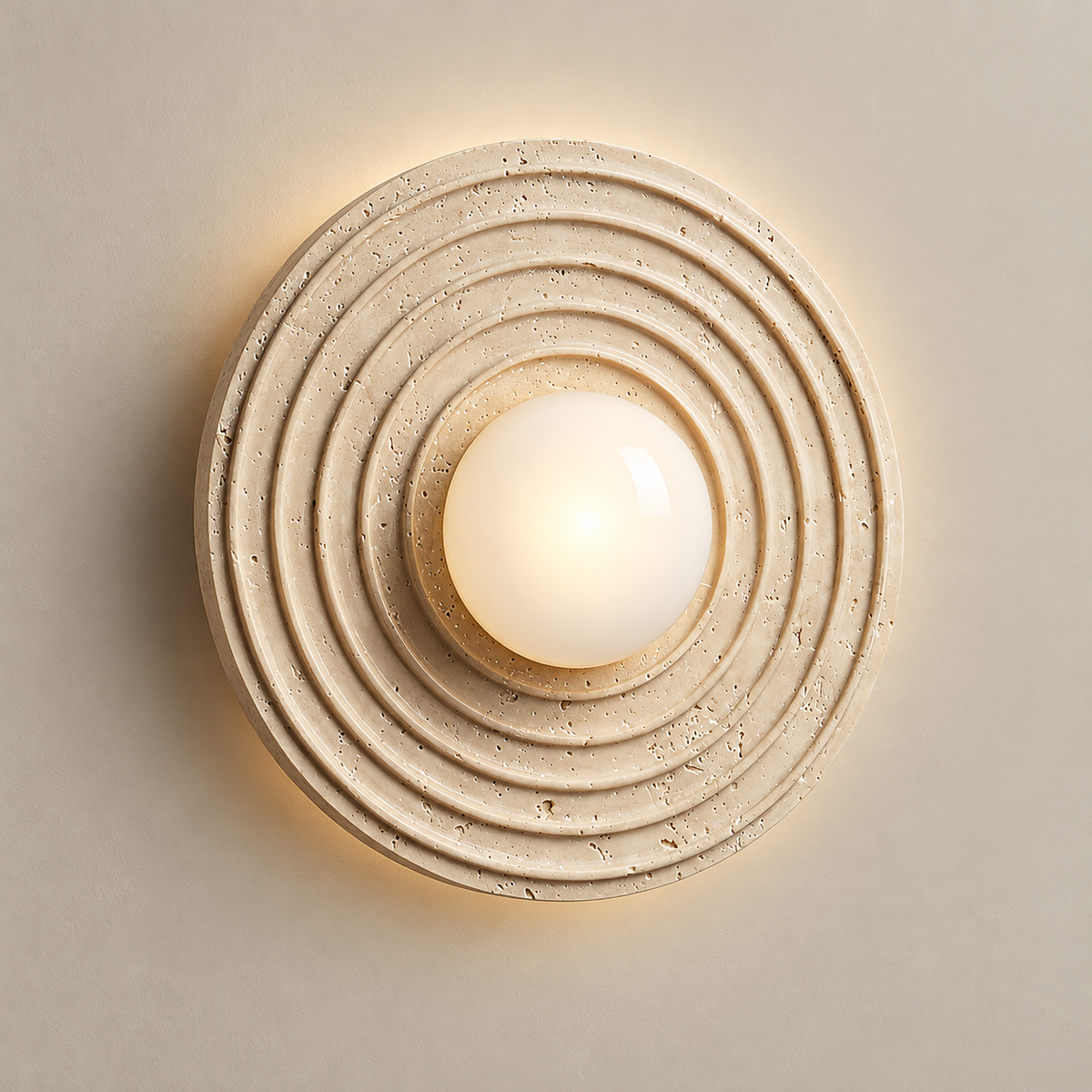 Selenitis Travertine Wall Sconce on a warm greige background; Beige / standard without pull cord