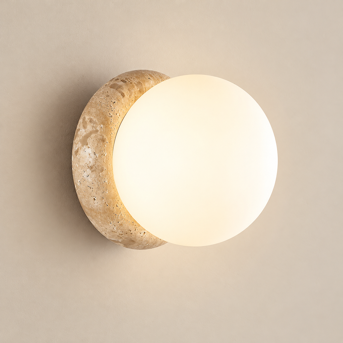 Asteroid Travertine Wall Sconce on a warm greige background; Beige & White glass / standard