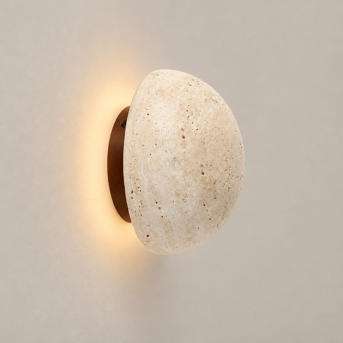 Ora Stone LED Wall Sconce on a warm greige background; Beige hemispherical wall lamp