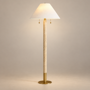 Sterling Japandi Travertine Floor Lamp on a warm greige background; White cone shade slender stone brass floor lamp