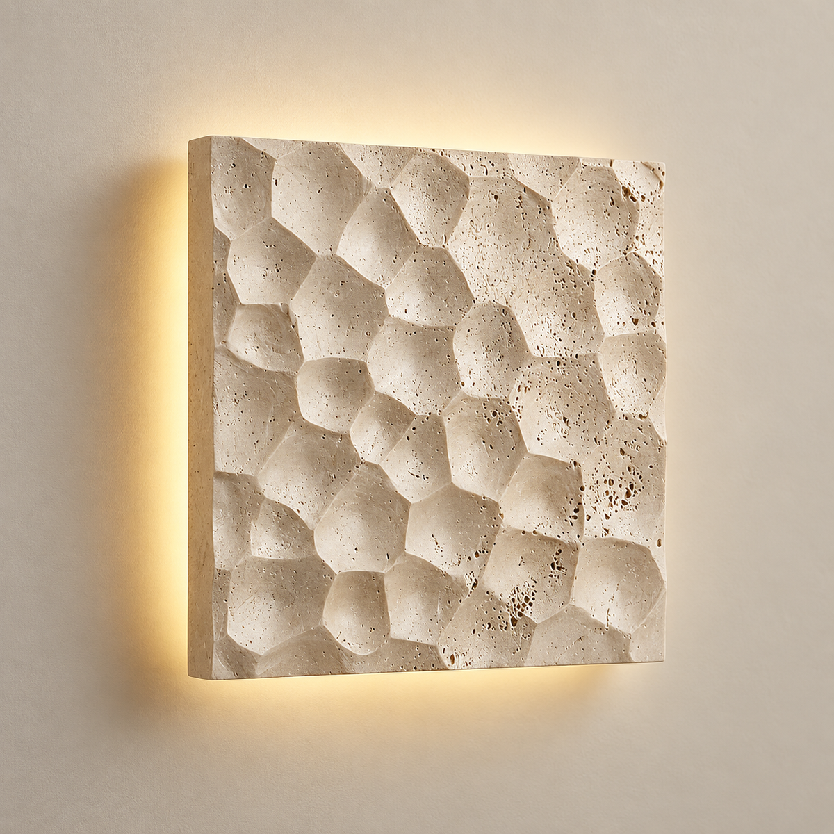 Modular Panel Travertine LED Wall Sconce on a warm greige background; Square irregular carved stone rear halo