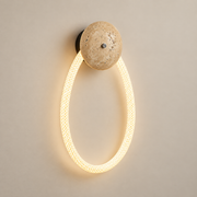 Rigel Travertine LED Wall Sconce on a warm greige background; Beige & White / Model A