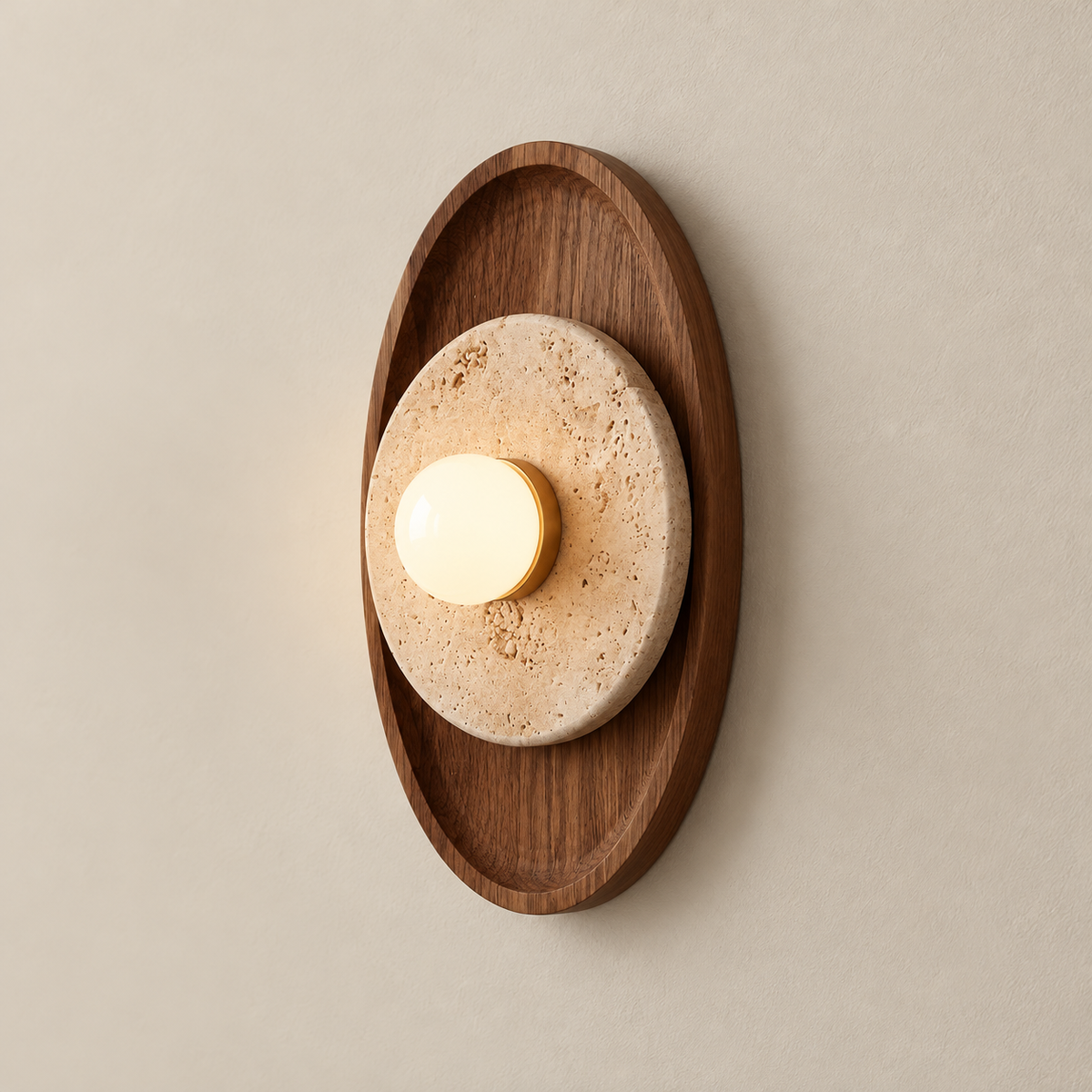 Petra Japandi Travertine Wall Sconce on a warm greige background; Petra oval / walnut / beige stone