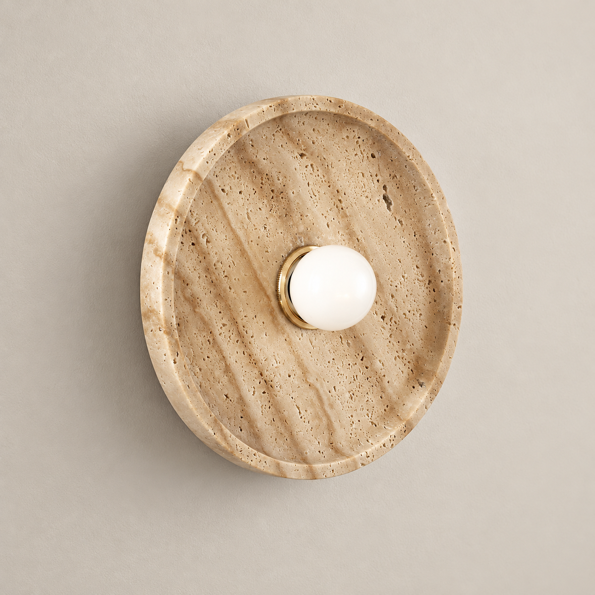 Celeste Japandi Travertine Wall Sconce on a warm greige background; Celeste beige round dish / small white globe