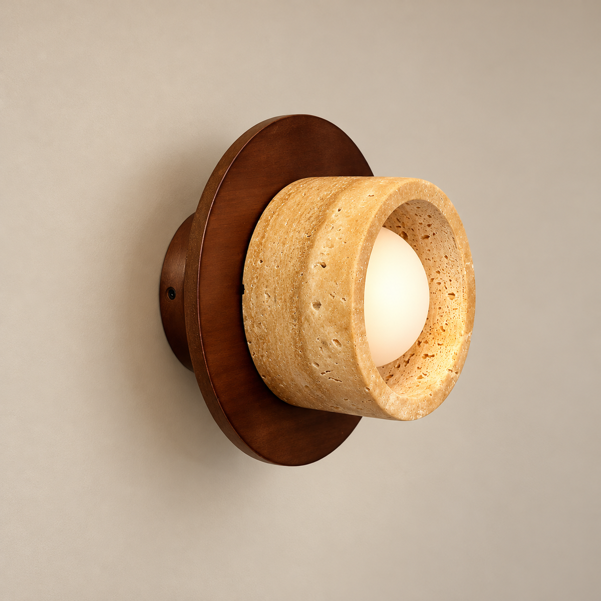 Logatec Japandi Travertine Wall Sconce on a warm greige background; Logatec walnut disc / thick beige ring / recessed globe