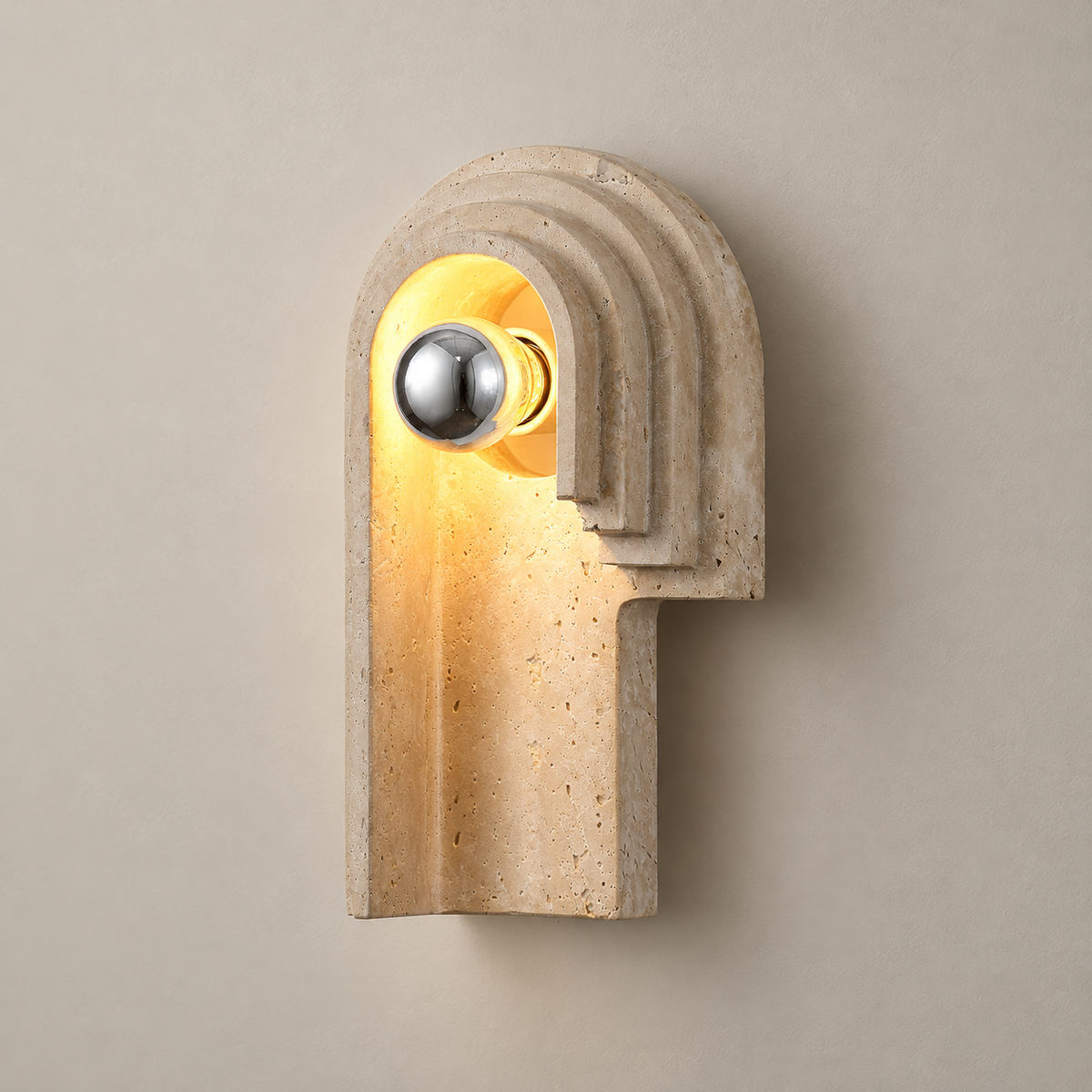 Bien Travertine Wall Sconce on a warm greige background; Bien left H30 / beige stepped arch / chrome capped bulb
