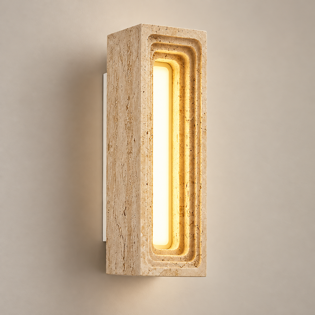 Bricks Travertine LED Wall Sconce on a warm greige background; Bricks beige rectangular carved block / warm center LED