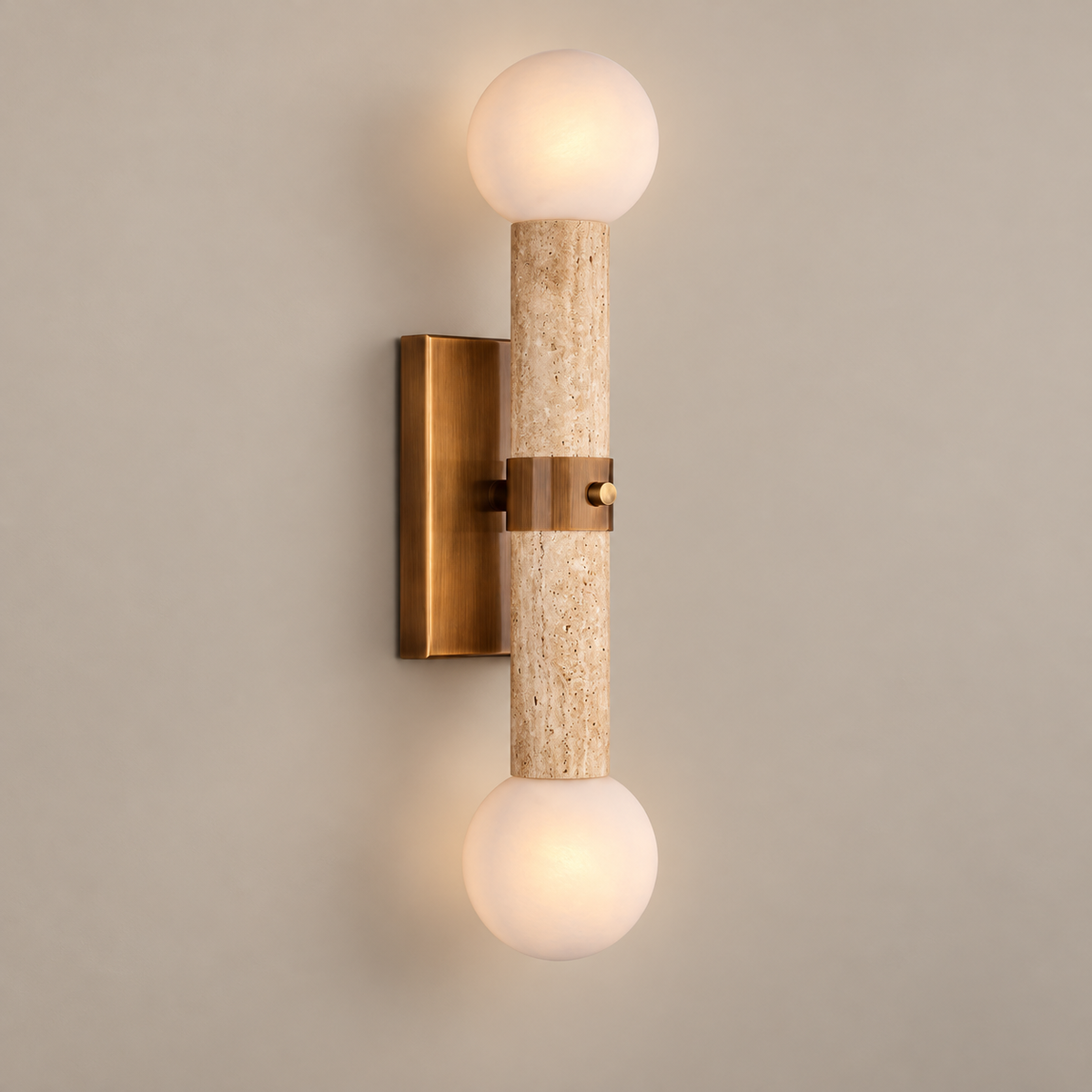 Bellini Travertine Globe Wall Sconce on a warm greige background; Beige stone, vintage brass and two white globes