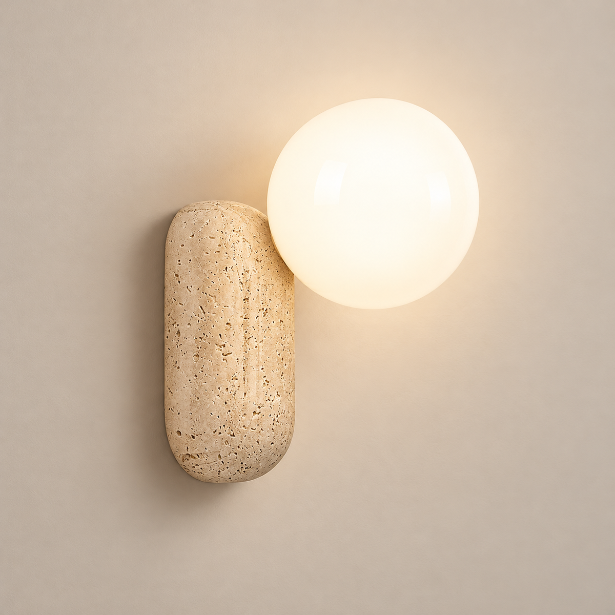 Origo Travertine Wall Sconce on a warm greige background; Beige capsule and white globe