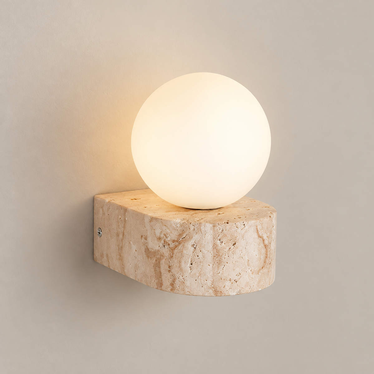 Byers Japandi Travertine Wall Sconce on a warm greige background; Beige D-shaped stone shelf and globe