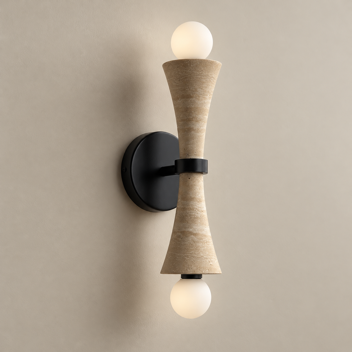 Dax Travertine Wall Sconce on a warm greige background; Beige travertine and black metal