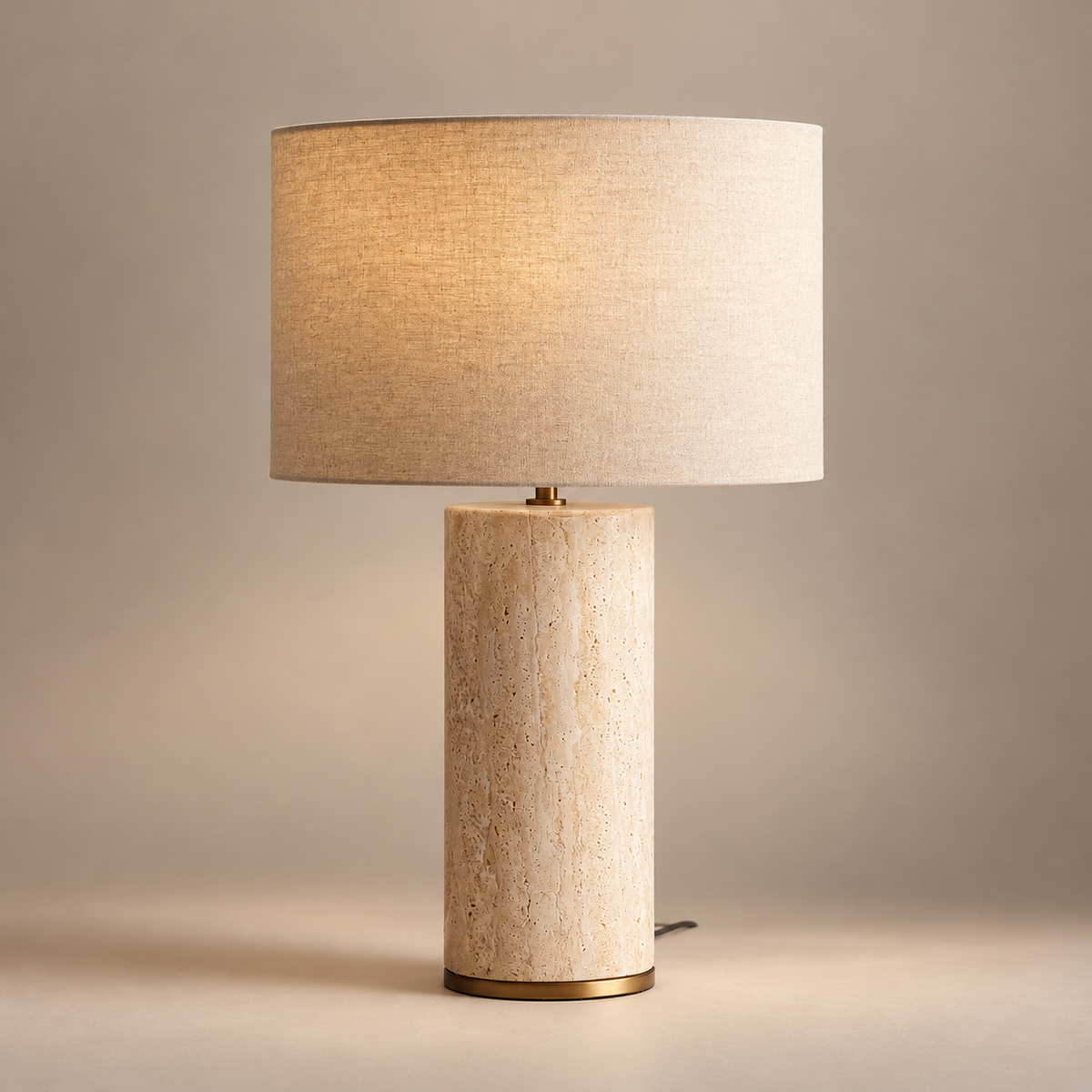 Remi Minimalist Stone Table Lamp on a warm greige background; Beige stone and plain linen shade