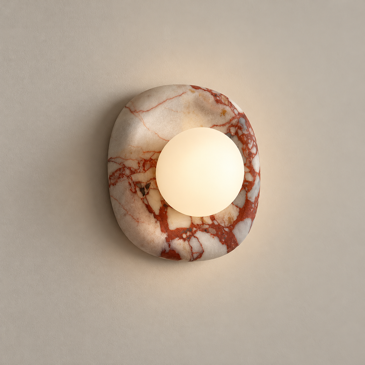 Orli Square Onyx Wall Sconce on a warm greige background; Red veined onyx and white glass