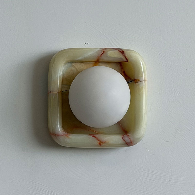 Quadra Onyx Wall Sconce with Glass Shade — L 16cm x W 9cm x H 16cm / L 6.3″ x W 3.5″ x H 6.3″; Cyan onyx; Spanish alabaster oblate