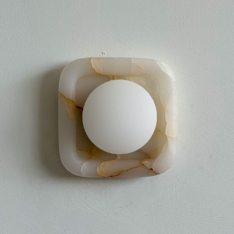 Quadra Onyx Wall Sconce with Glass Shade — L 16cm x W 9cm x H 16cm / L 6.3″ x W 3.5″ x H 6.3″; White onyx; Glass oblate