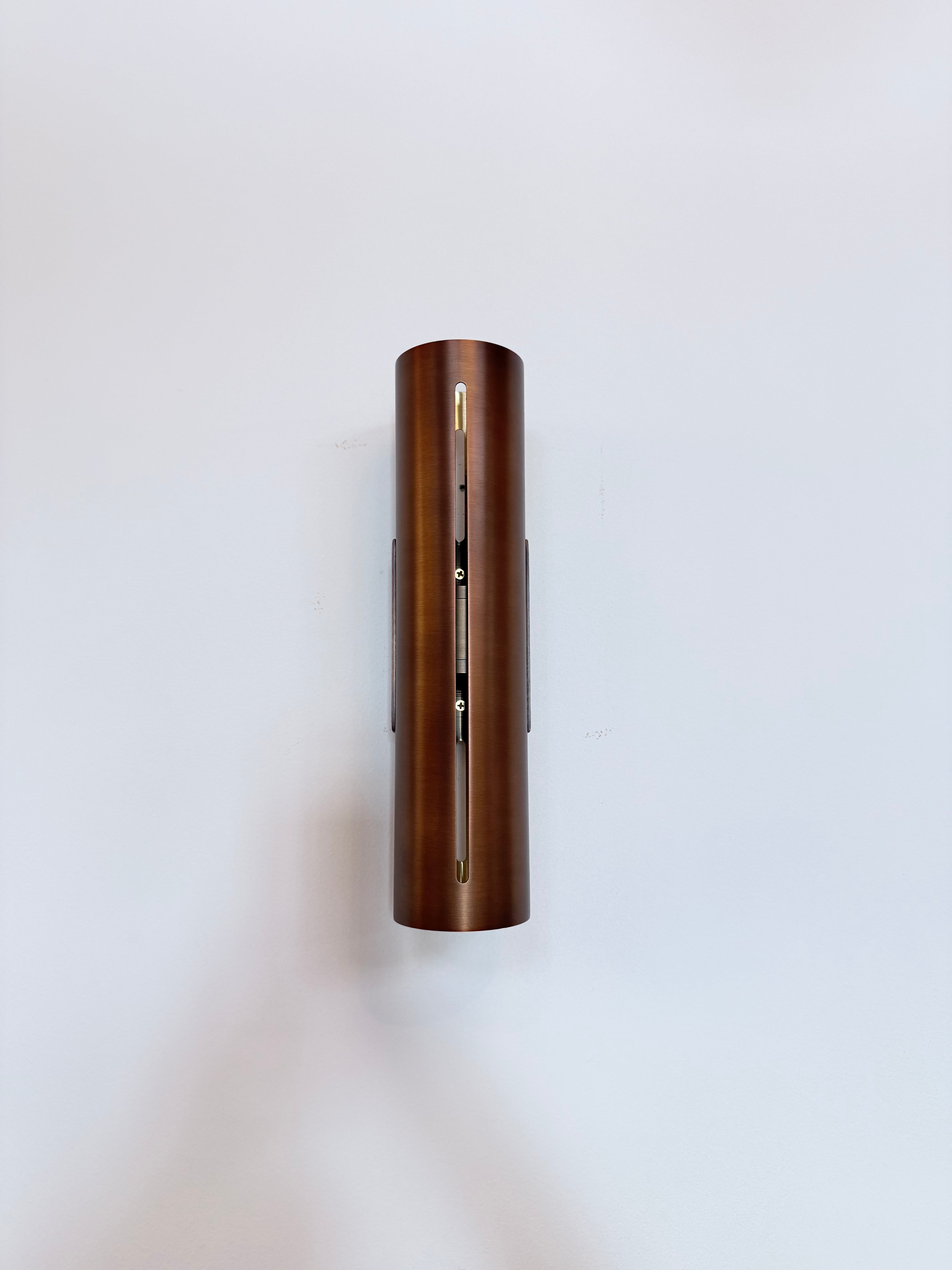 Minimalist Brass Cylinder Wall Sconce in Antique Brass