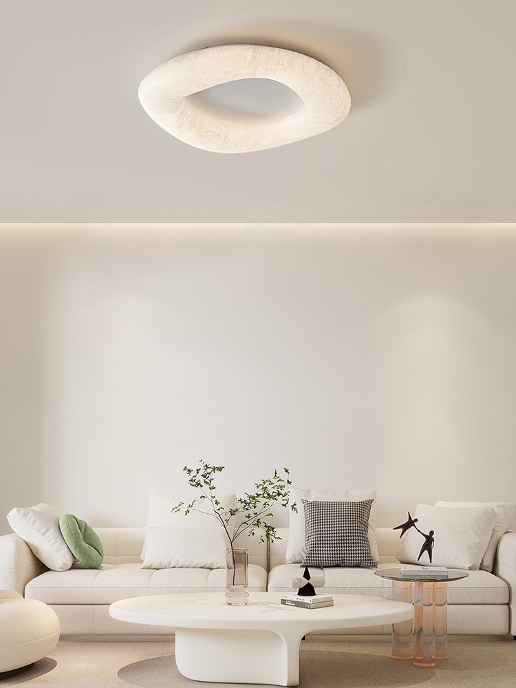 Mulberry silk ring ceiling light above a living room