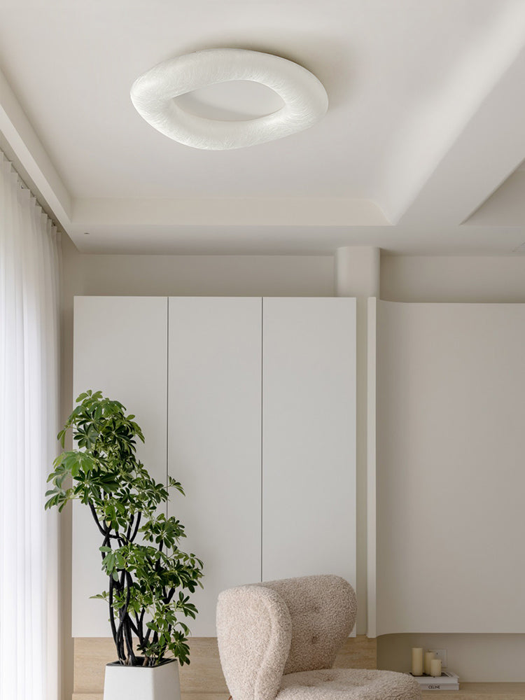 Mulberry silk ring ceiling light in a reading corner