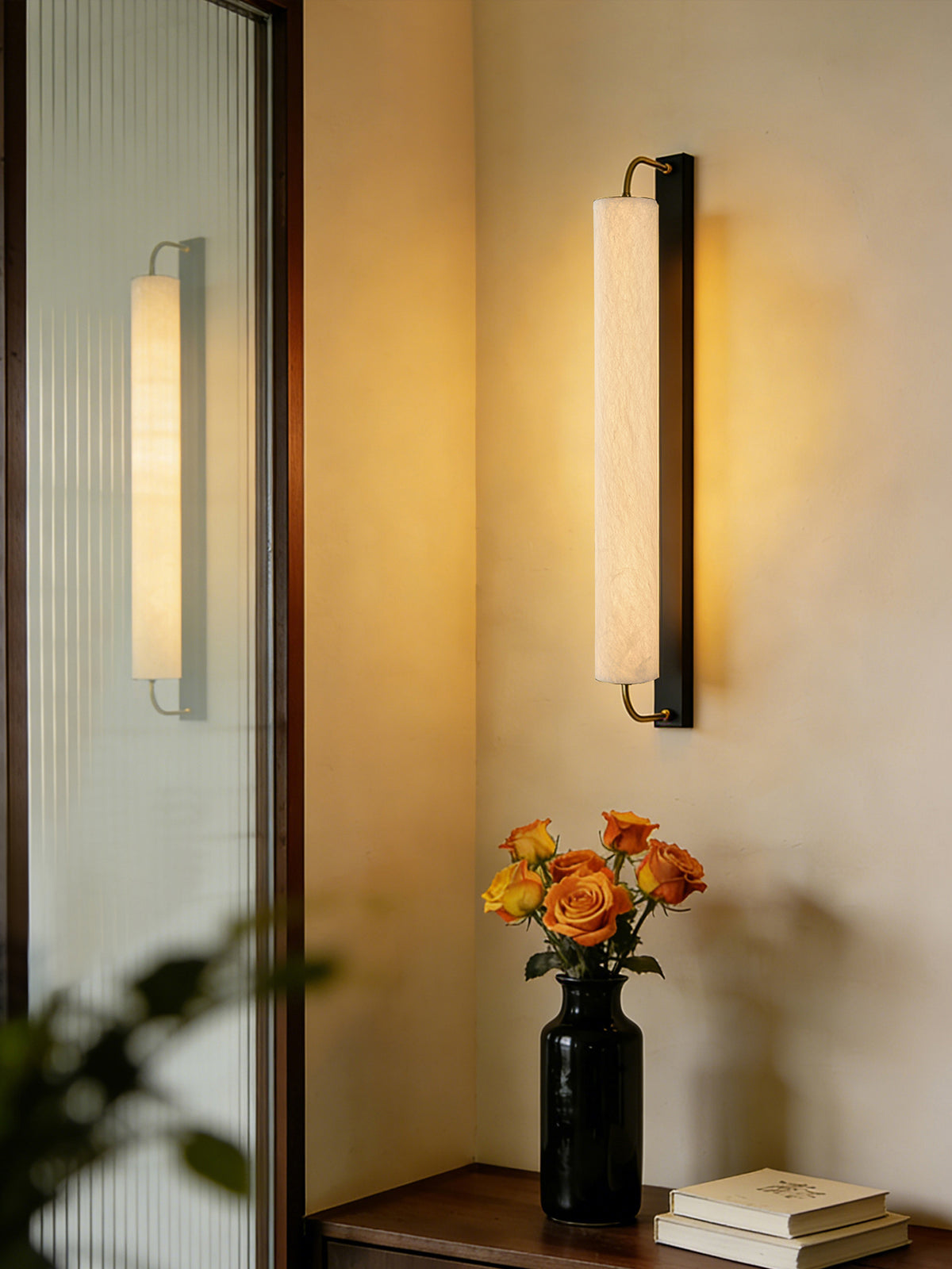 Mulberry silk cylinder wall sconce beside a mirror