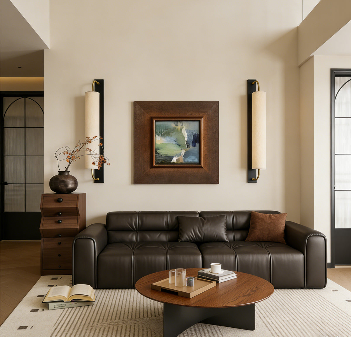Paired mulberry silk cylinder wall sconces above a sofa