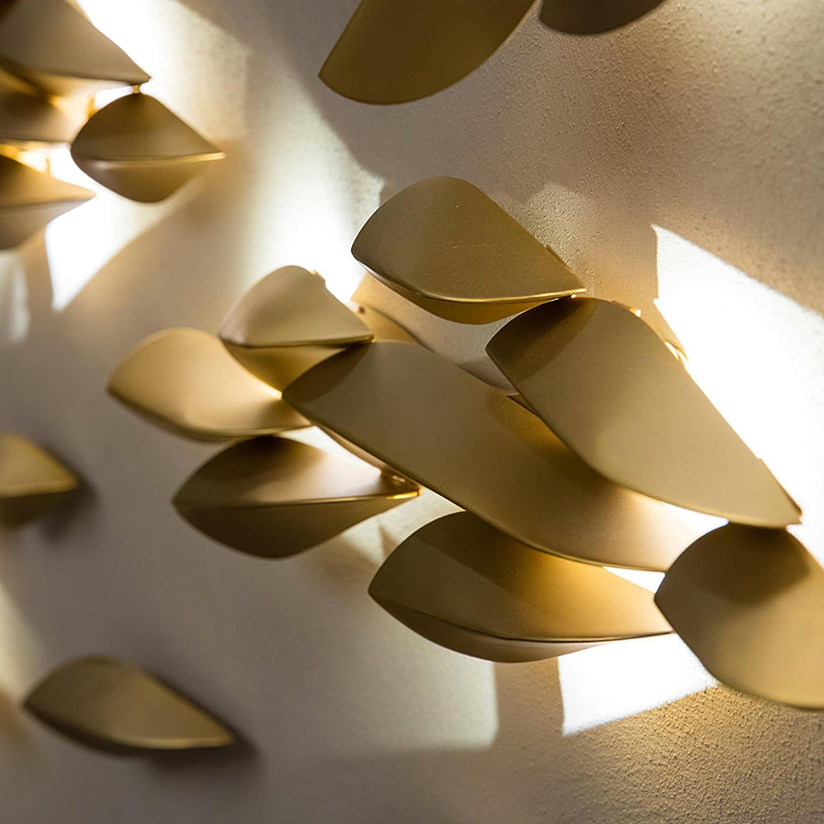 1273 brass leaf wall light illuminated metal leaf close-up