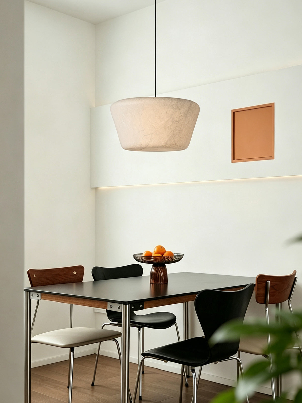 Arelmive silk pendant above a modern dining table, original room photograph