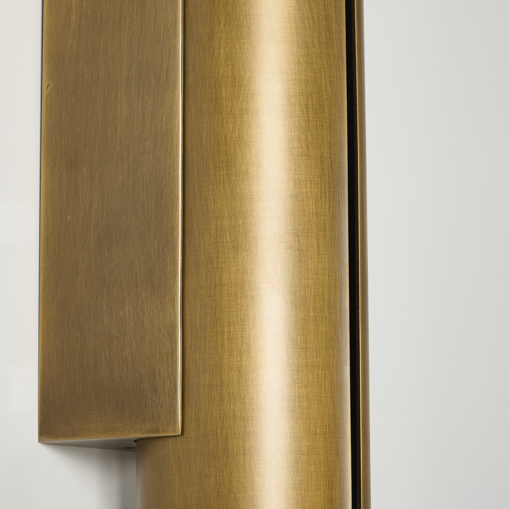 Brushed antique brass finish and rectangular mounting plate detail