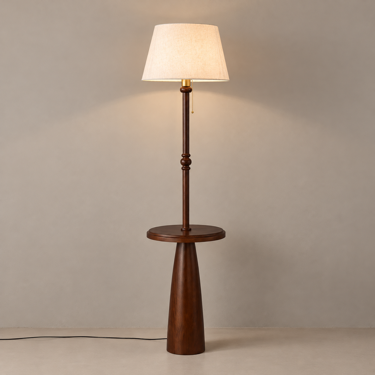 Ornvale - Plain woven-shade ash wood floor lamp with round tray, warmly lit on a taupe floor