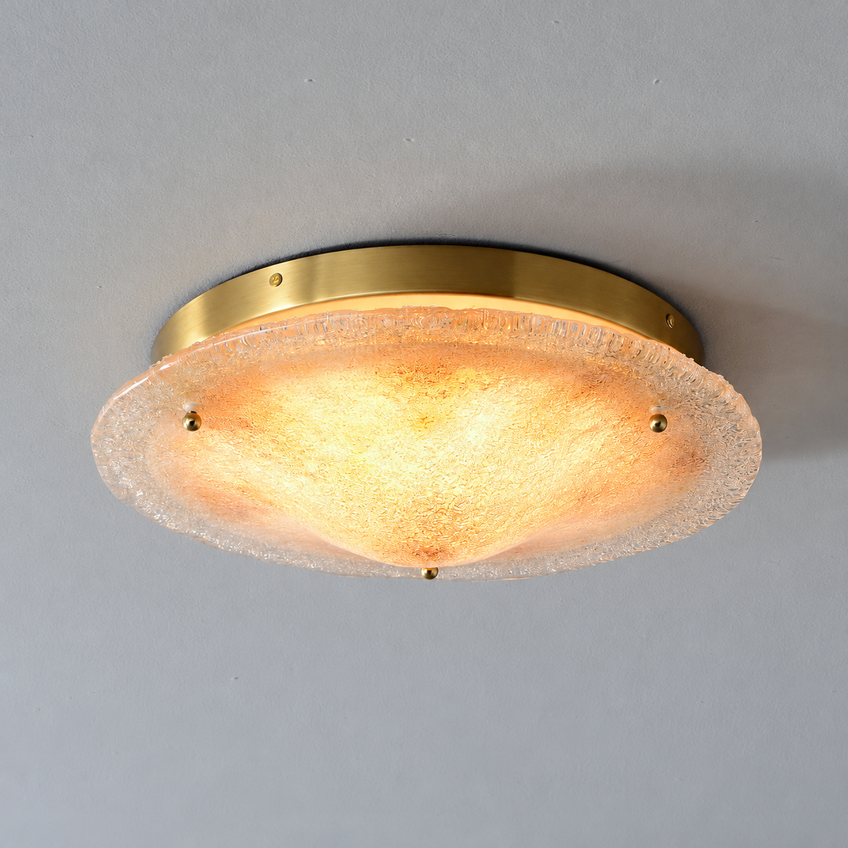 Gold hand-fired glass ceiling light — warm-lit product view
