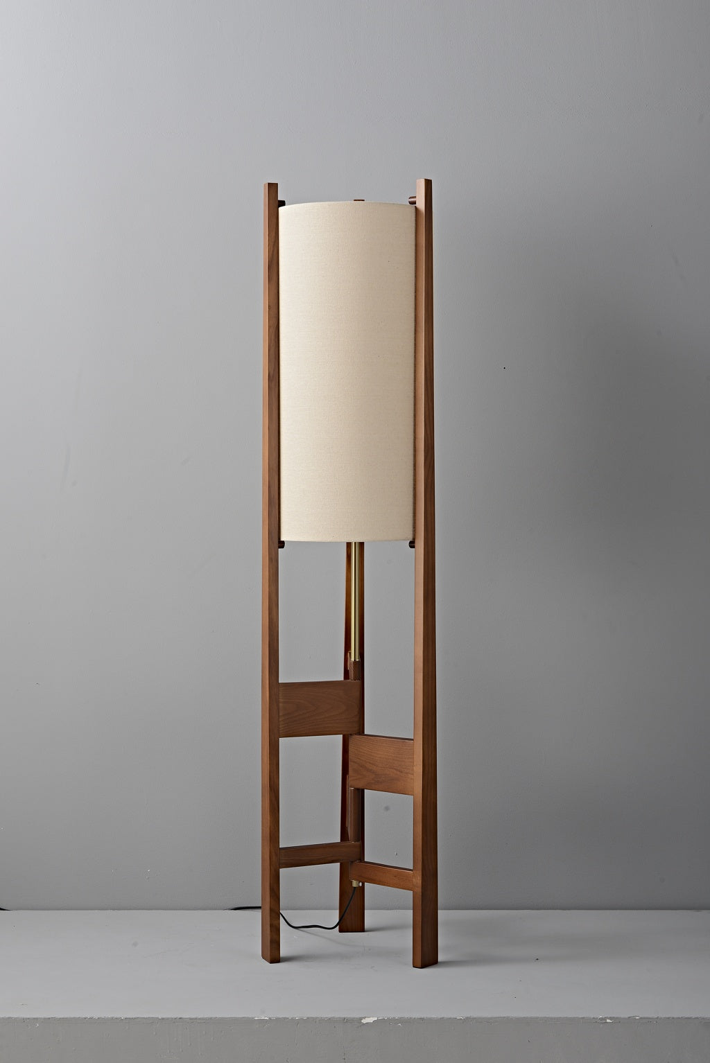 Ashverelle ash wood floor lamp — unlit fabric shade and walnut-tone frame