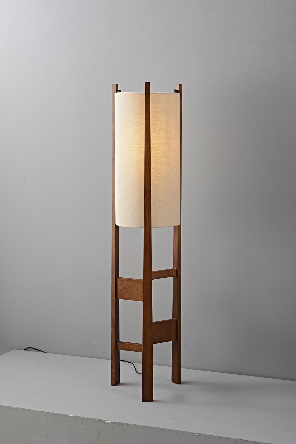 Ashverelle ash wood floor lamp — warm-lit complete fixture, alternate view
